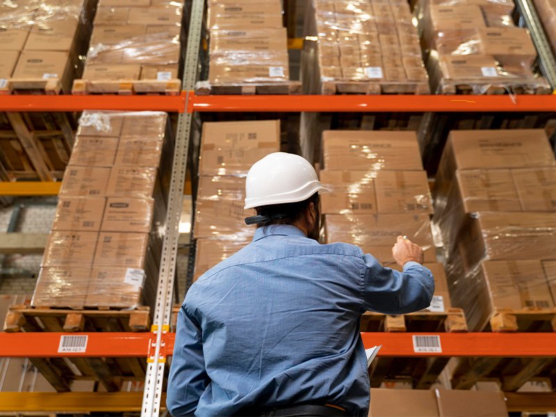 man-with-helmet-working-warehouse